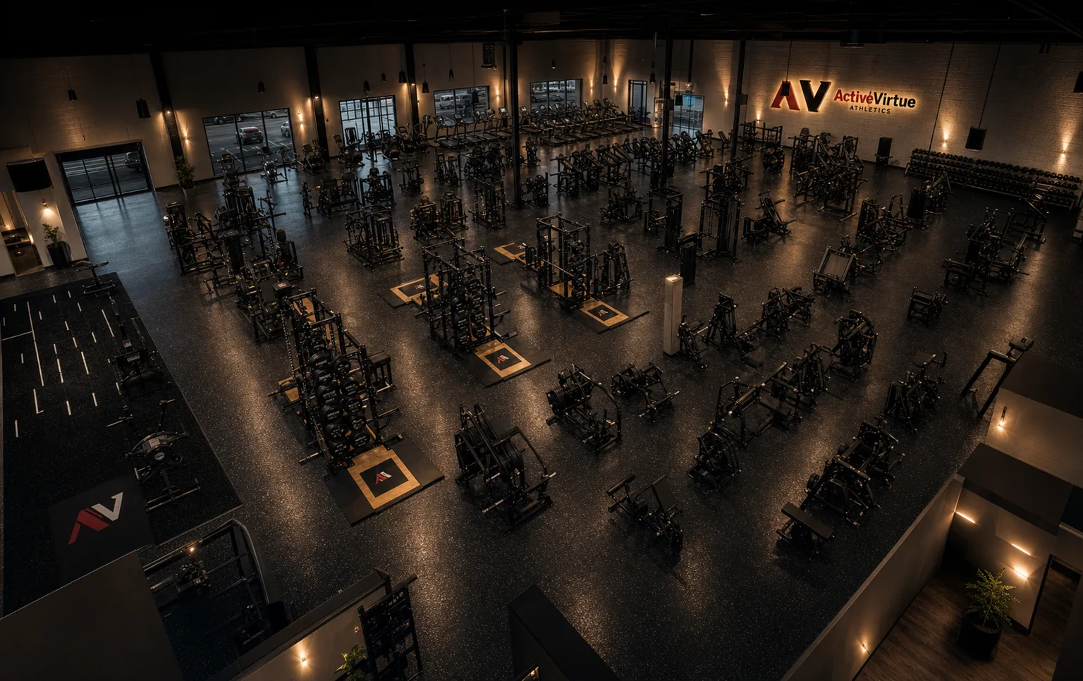 VirtueField concept render — elevated wide overhead view of the full training floor with racks, platforms and dumbbell row